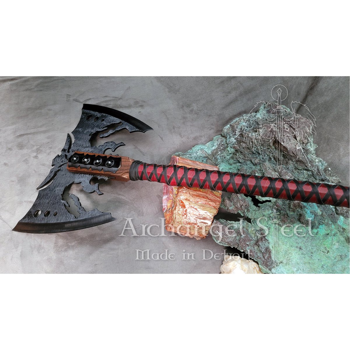 One of our Dragon Battle Axes. If you're into rocks/minerals too, the large chunk of raw copper is from Michigan's Keweenaw Peninsula. The red rock is petrified wood from the Petrified Forest National Park, AZ that I purchased from the Hopi tribe on one of my trips there.