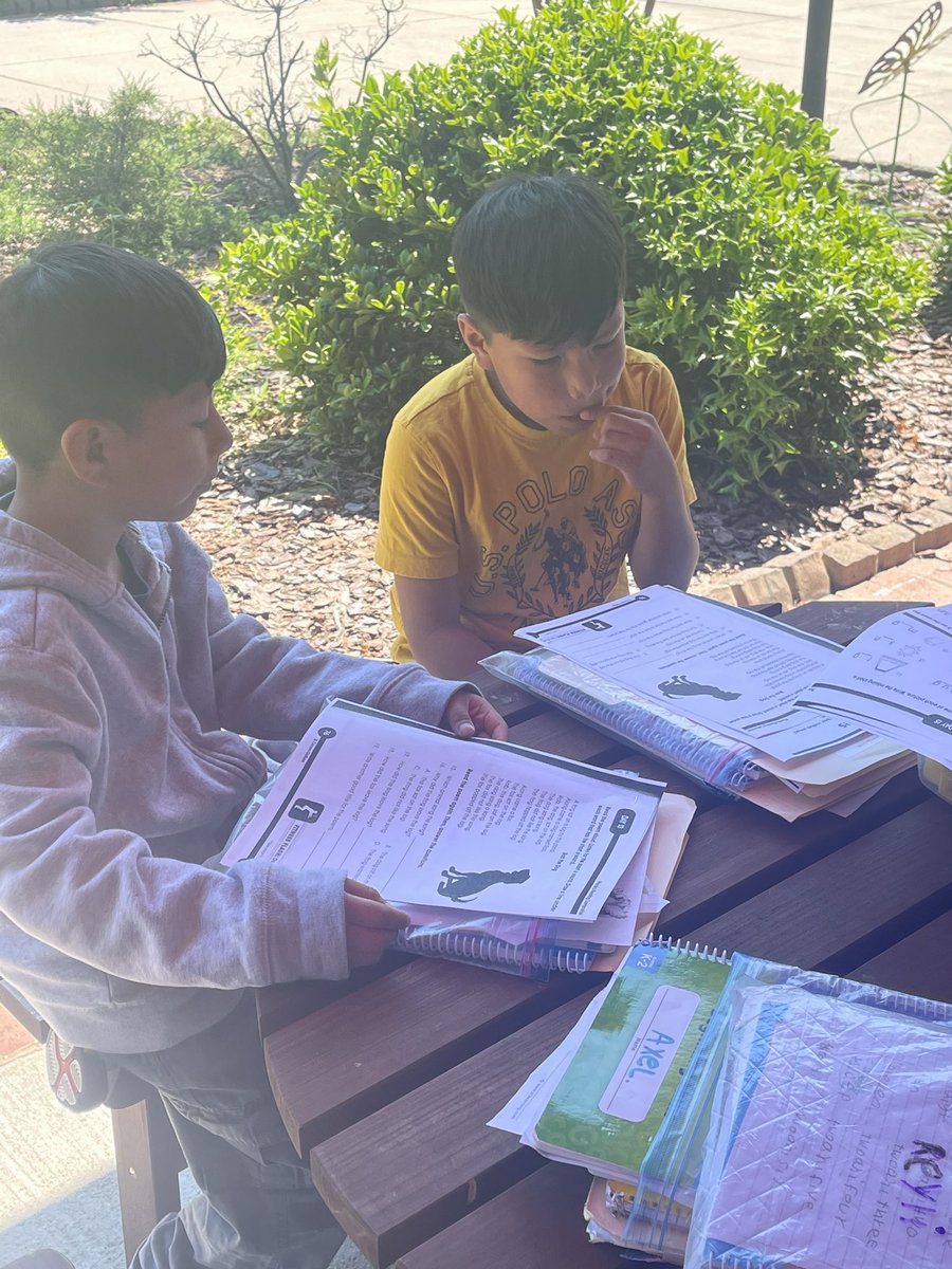 Mrs. Soto is capitalizing on a beautiful morning by using the courtyard during her small group lesson. ☀️