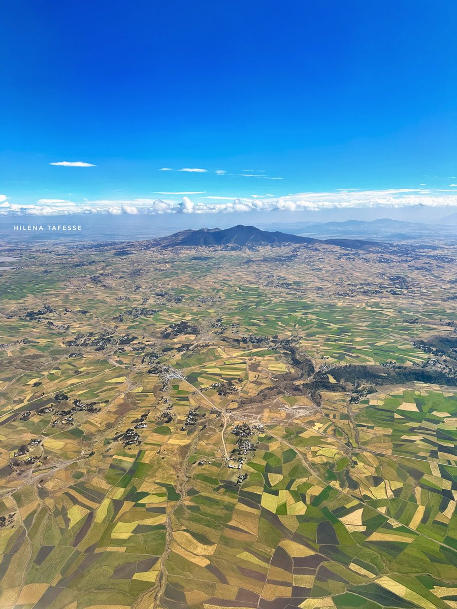 The breathtaking view from above, farm fields and majestic mountains😍 #CaptureEthiopia #Ethiopia #VisitEthiopia #LandOfOrigins