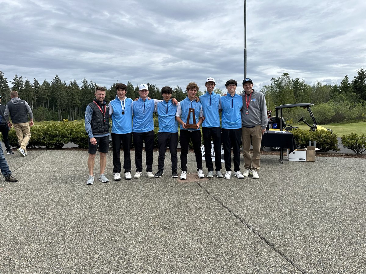 The team with the third place trophy