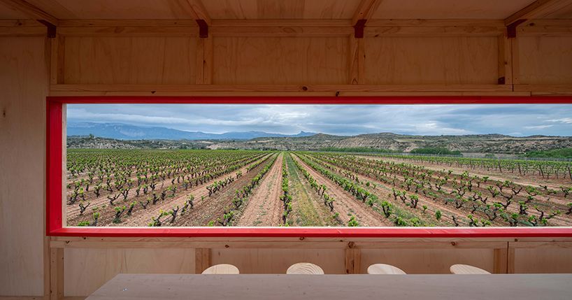 red curtains bridge the spanish vineyard with the domestic for pavilion at concéntrico buff.ly/3VcGcw0