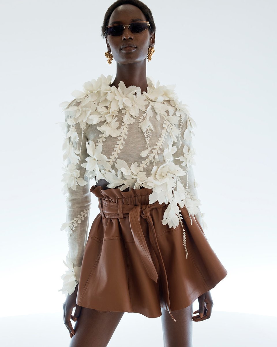 Up Close: The Harmony Lasercut Top and Leather Short, styled with the Zimmermann Gleam Cat Eye. 
Shop New Arrivals > with-zim.com/TW-spring-24