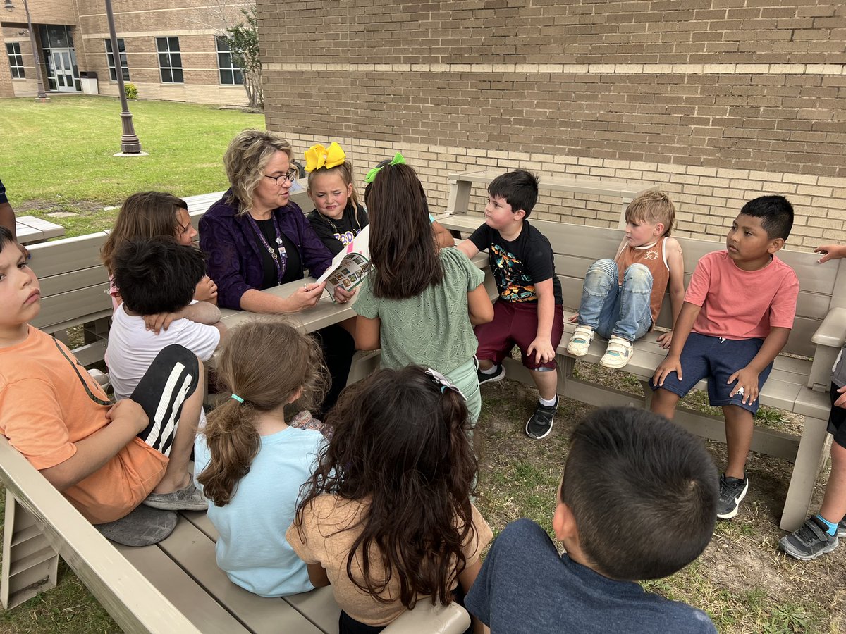 We love outdoor read alouds with Mrs. Holland!