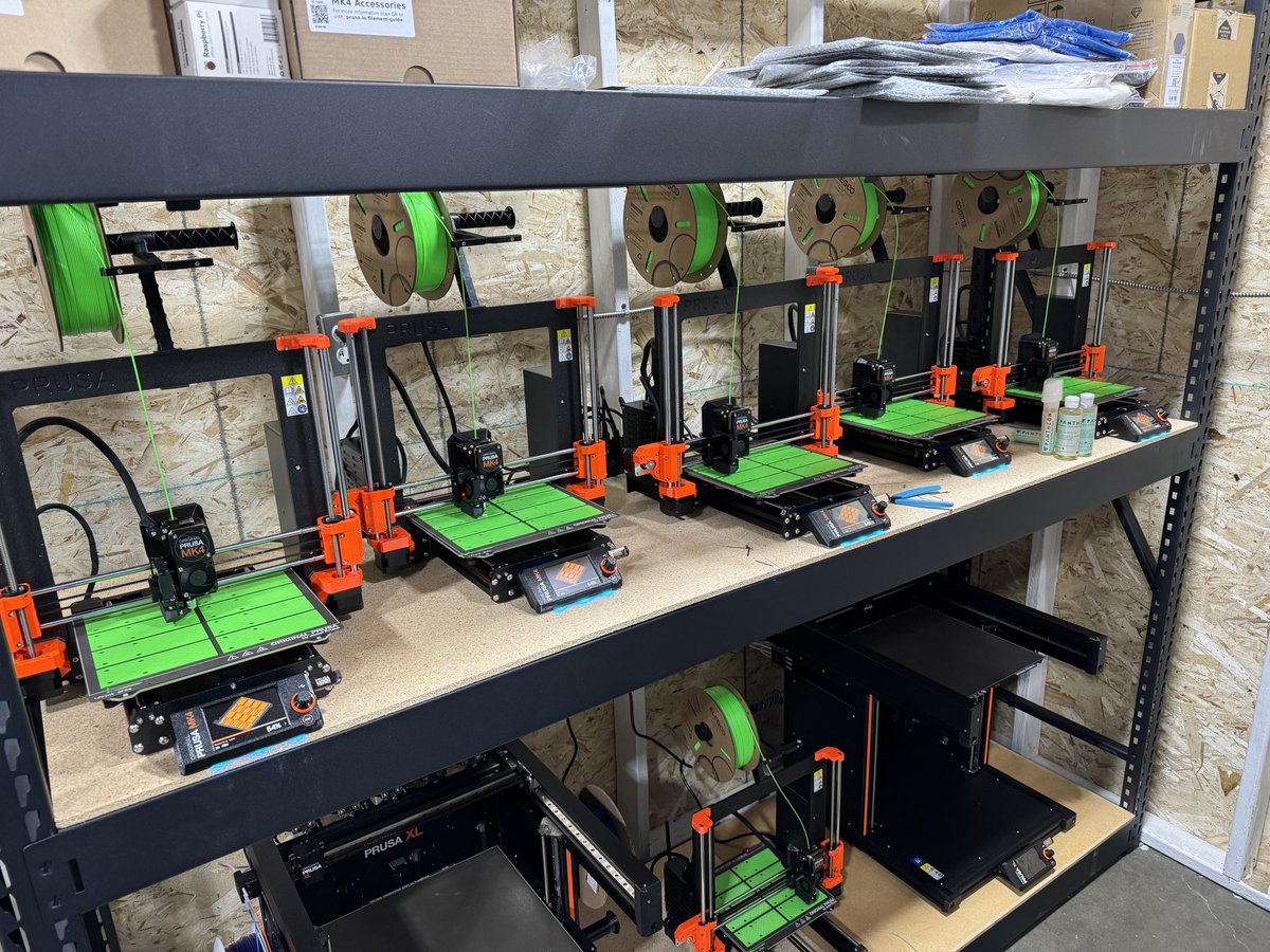 The @Prusa3D mk4 farm is going strong! Running on some really cool looking @Elegoo_Official filament. SO GREEN!