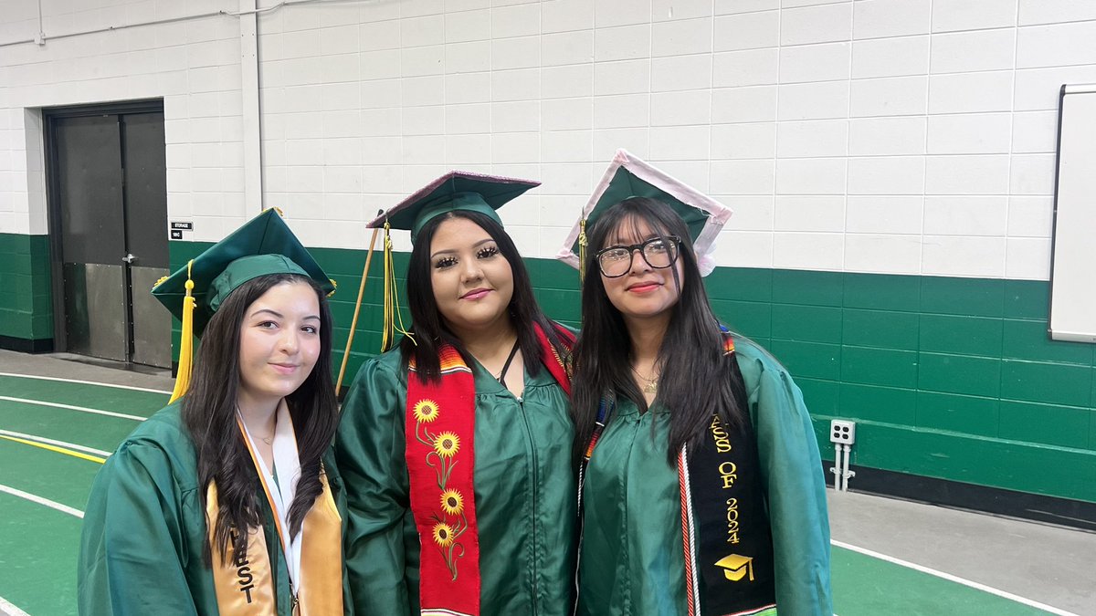 District214's tweet photo. The Grens are getting ready to step onto the field! #214grad https://t.co/VWzSGzFrGj