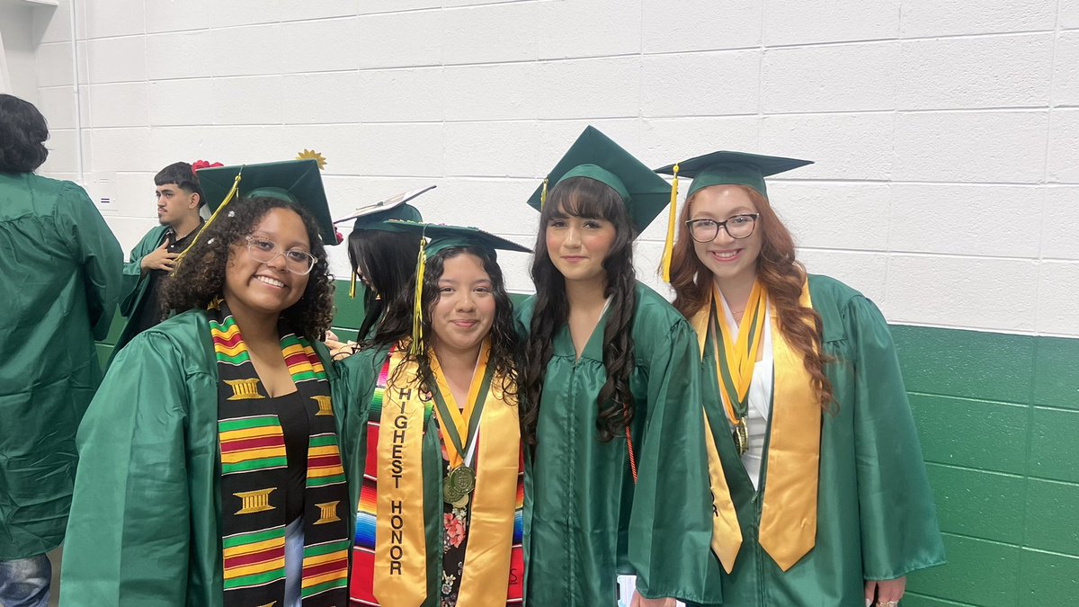 District214's tweet photo. The Grens are getting ready to step onto the field! #214grad https://t.co/VWzSGzFrGj