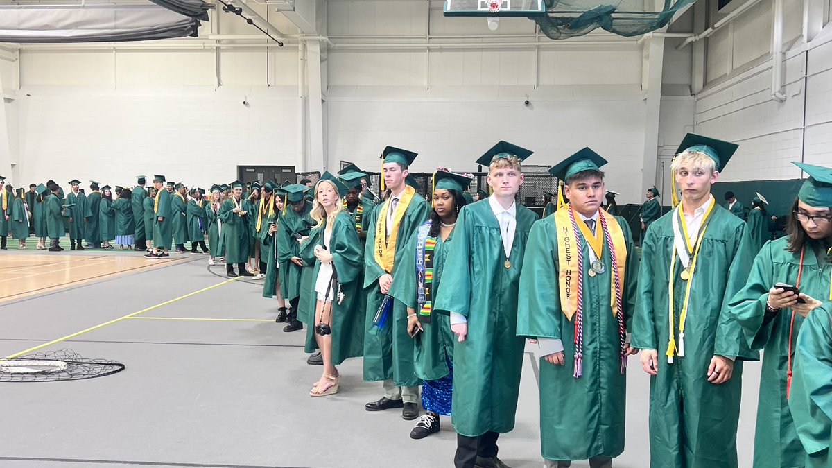 District214's tweet photo. The Grens are getting ready to step onto the field! #214grad https://t.co/VWzSGzFrGj