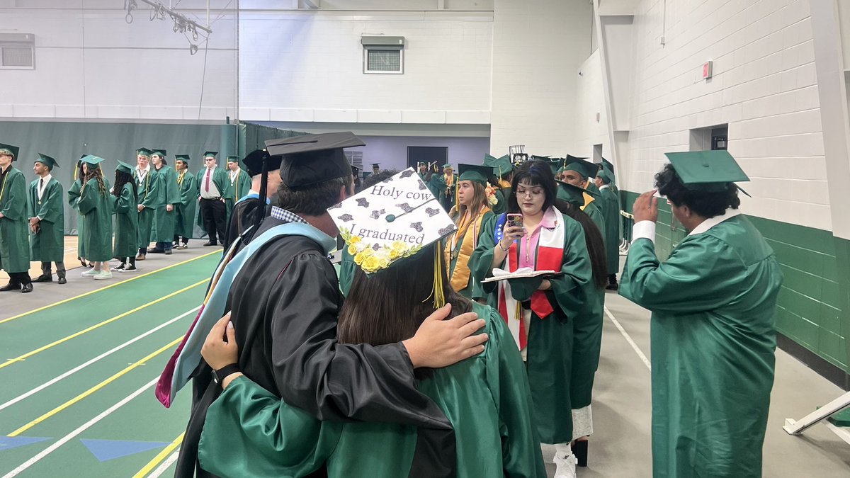 District214's tweet photo. The Grens are getting ready to step onto the field! #214grad https://t.co/VWzSGzFrGj