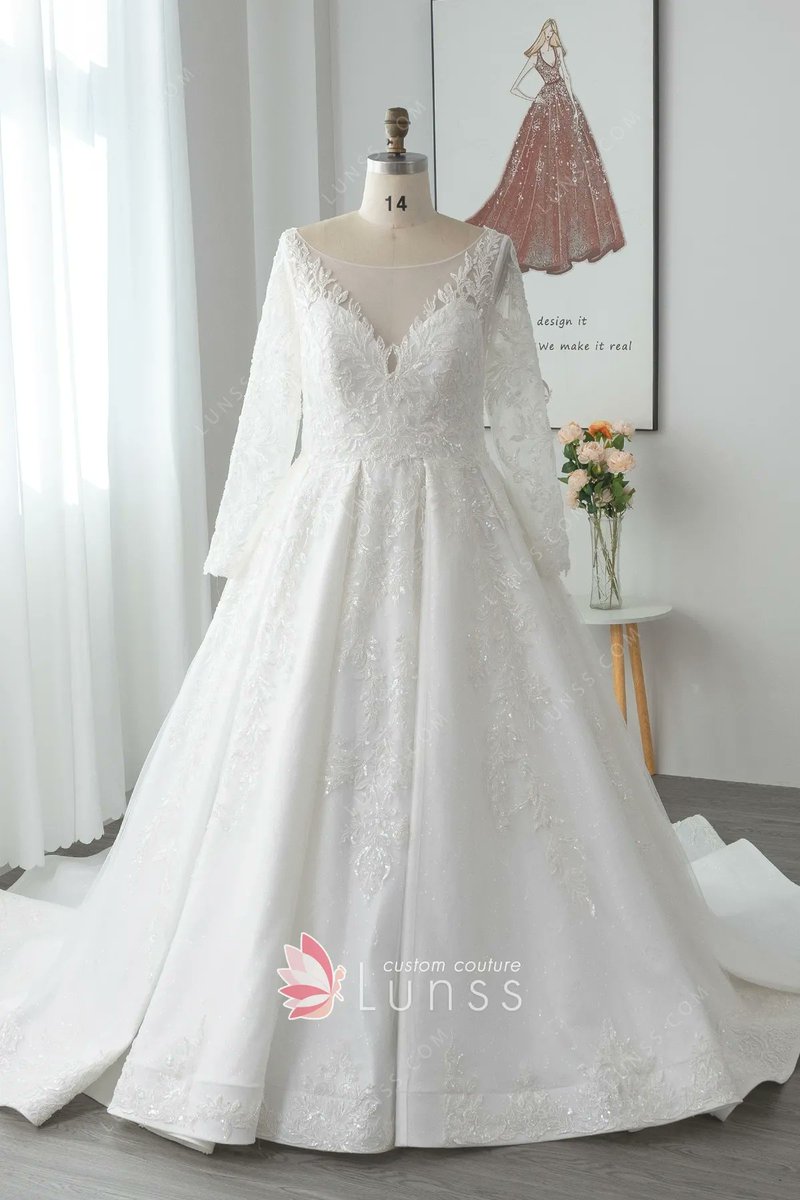 LunssCouture's tweet photo. The romantic satin wedding ball gown features beaded embroidered lace appliqués on a plunging bodice with sheer long sleeves. Illusion back decorated with buttons. Chapel train.
#BallGown #WeddingDress #LongSleeve #Satin #Beaded #Lace #IllusionBack #Lunss
https://t.co/FGhGoYeYsP https://t.co/ojEQd7wnDd