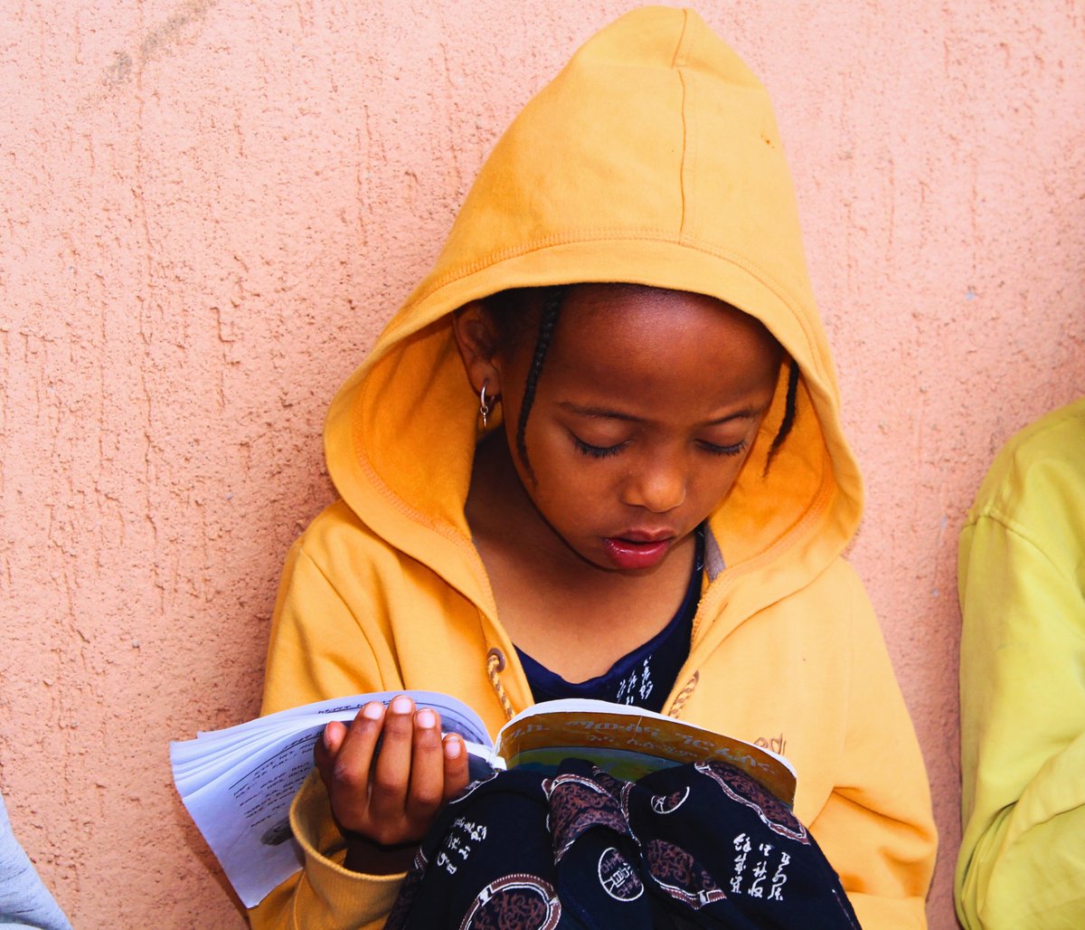 With wide eyes and a curious heart, Hiba dives into children's stories at Lelt's community center, discovering new worlds and expanding her imagination with each turn of the page. 📚✨ 
 #ReadingIsMagic #ChildhoodWonder #LeltCommunityCenter