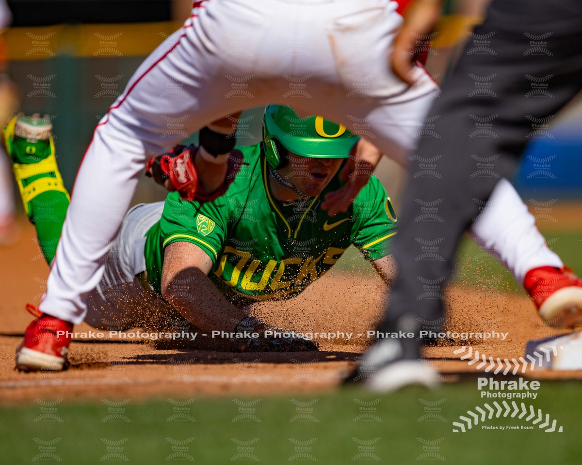 Catcher Chase Meggers (27) of the Oregon Ducks slides into third base during a PAC-12 Tournament game against the Utah Utes on May 22, 2024 at Scottsdale Stadium in Scottsdale, Arizona. (Freek Bouw/Four Seam Images) @meggers_chase @OregonBaseball #pac12bsbtournament #pac12bsb