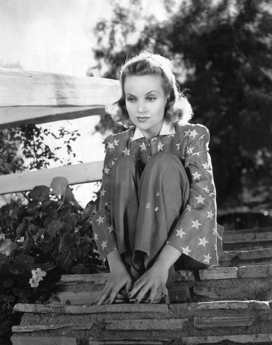 A rather pensive Carole Lombard, at her ranch in Encino, c1940.