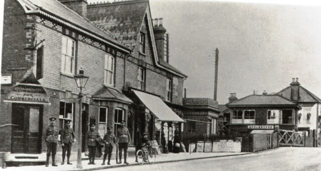 #ThrowbackThursday – Station gates, #Addlestone, c.1918 The Rose Temperance Tavern seen on the corner of Alexandra Road remained in business until 1931. It was formerly known as the Addlestone Coffee Tavern. #LocalHistory #TBT