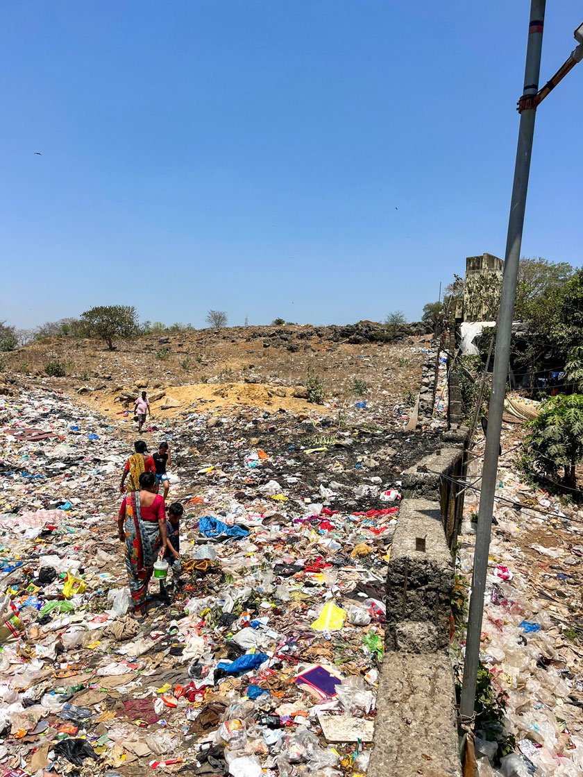 Residents of Damu Nagar have to: 1. Step over a one-foot wall 2. Then walk through a pile of garbage with a strong smell of faecal matter 3. Only then can they access the open field - the only place where they can defecate