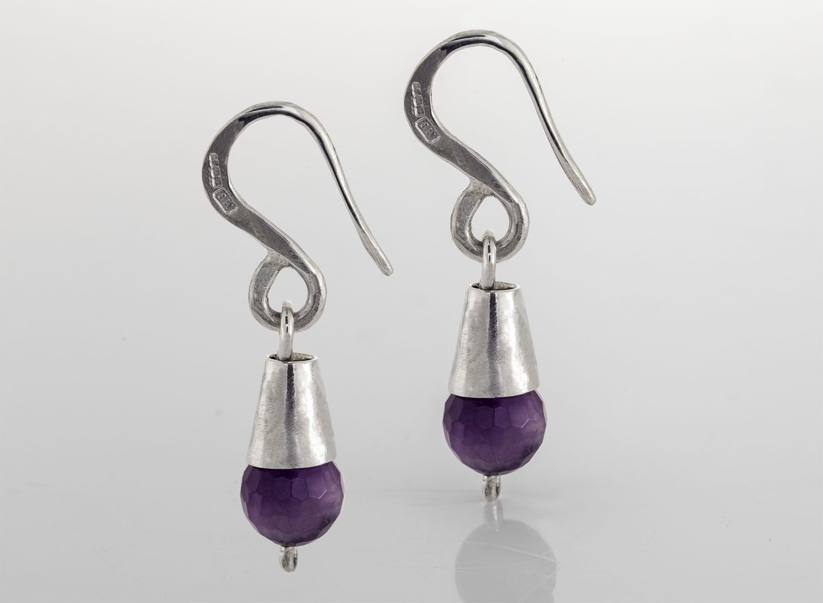 Cone shaped silver dangle earrings with amethyst stone. For handmade, textured and hallmarked silver jewellery visit  margaretgriffithsilverjewellery.com #sterlingsilver #Margriff #earlybiz #FCworkspace #etsy