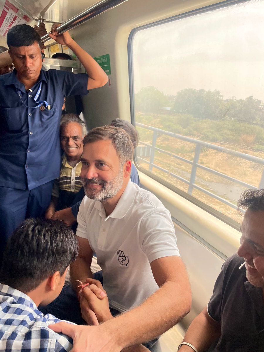 A youth takes blessing of Rahul Gandhi as he takes the Delhi Metro on the way to an election campaign in North West Delhi. Remember, Delhi Metro was built majorly under congress govts. Congress builds, Modi sells!