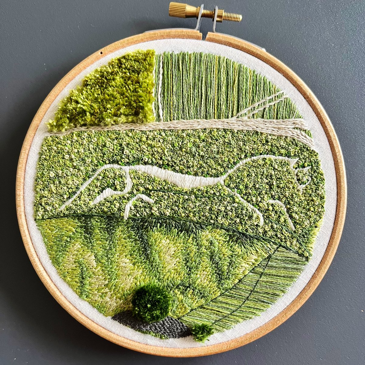 When I’m not clambering around medieval churches, I embroider strange things. Here’s one I just finished of the White Horse at Uffington - a prehistoric landmark cared for by the @nationaltrust. I spent so much time here as a child and it’s always loomed large in my imagination.