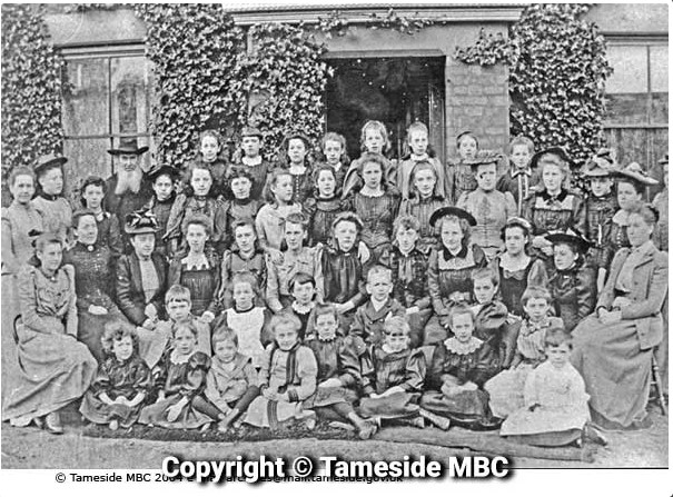 Looking Back: Fairfield Girls' School, staff and pupils outside the main entrance. The minister was the Rev Austin Smith. It would seem the picture was taken in the 1890s. tameside.gov.uk/archives