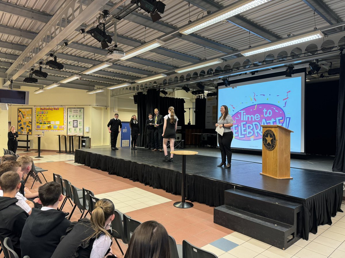Miss McGrattan handing out awards at the final S2 Assembly of the year. #ambition