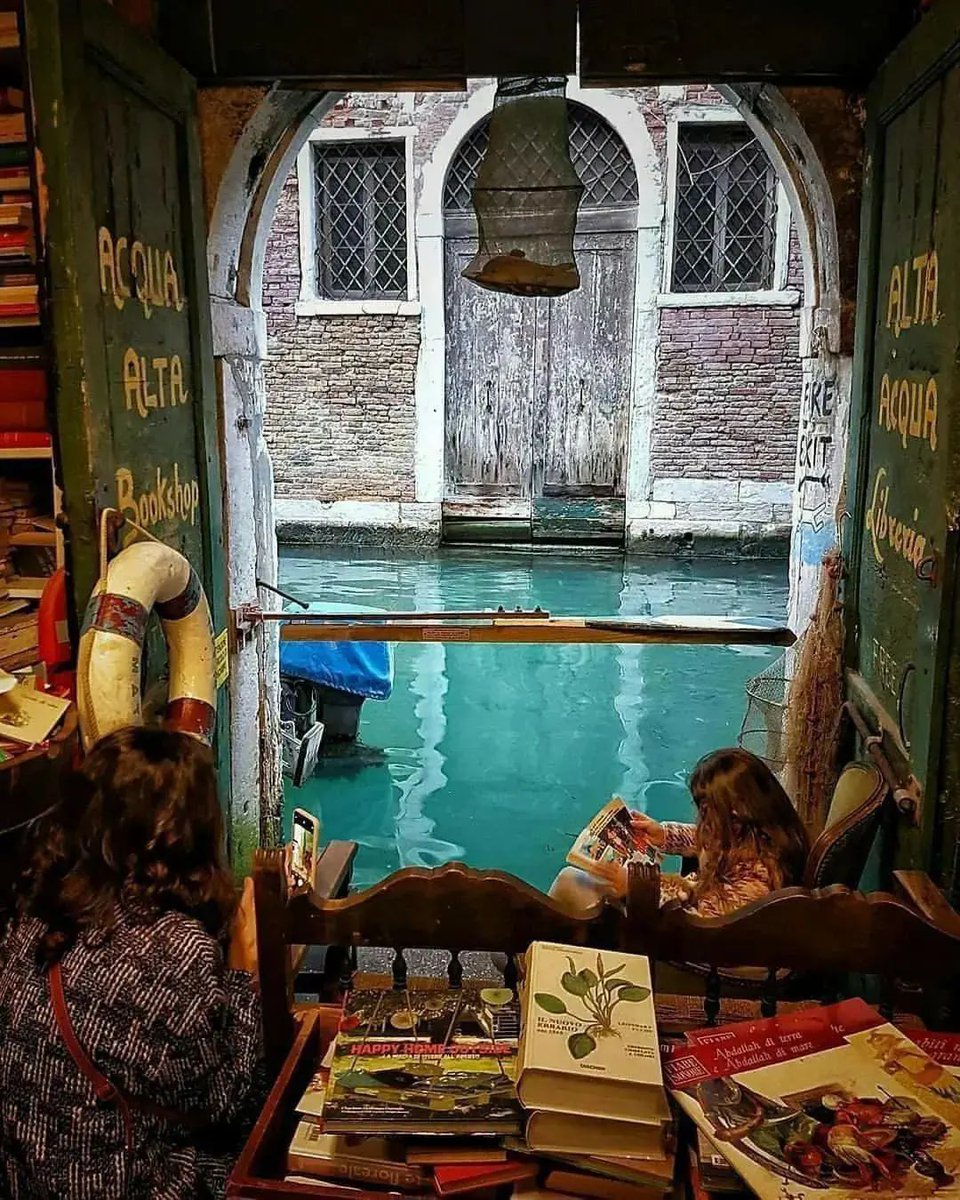 Libreria Acqua Alta; a bookstore in Venice, Italy : This Venice bookstore has resigned itself to constant flooding by keeping it's books in bathtubs and boats. Keeping a collection of books in a city where the roads are made of water is a dangerous idea to begin with, but