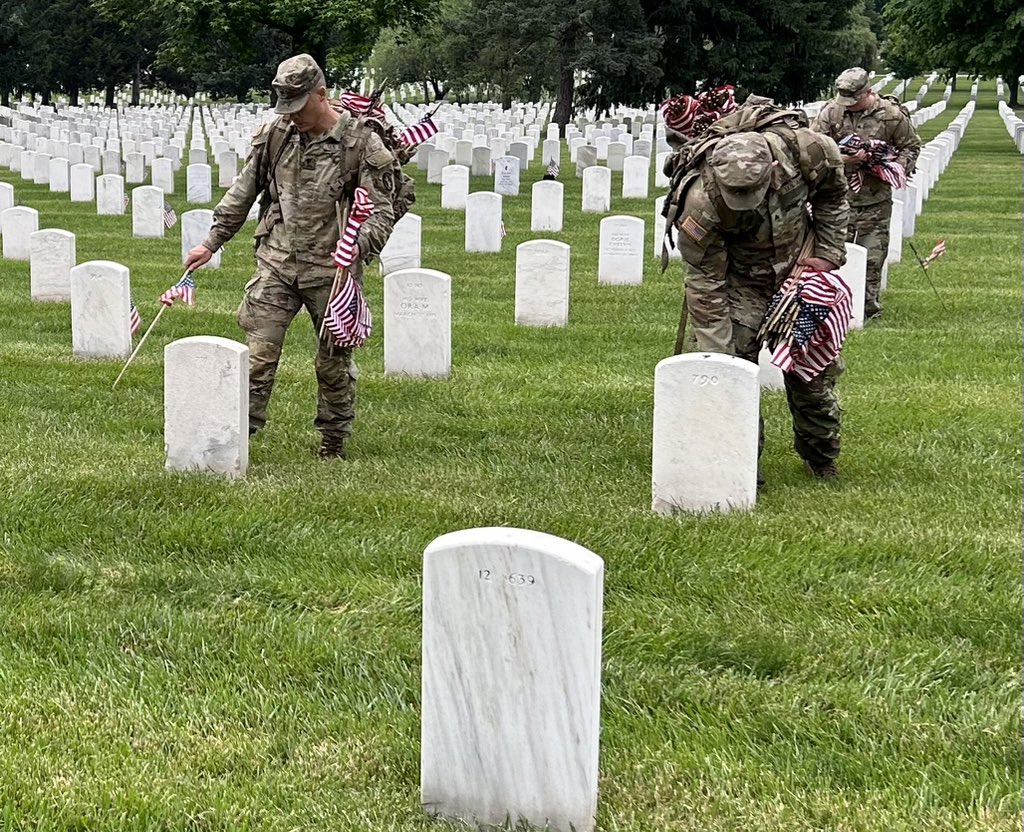 Each flag is placed one boot-length from the base of the headstones here at Arlington National Cemetery.