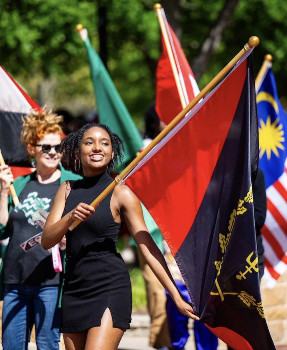 Reese Marshall, a student at the University of North Texas, participated in the Parade of Nations. 'I did so in the memory of my family, my people, and as an acknowledgement to the very same reasons that Mr.Charles created the flag-To create progress for African Americans 🖤🔱❤️