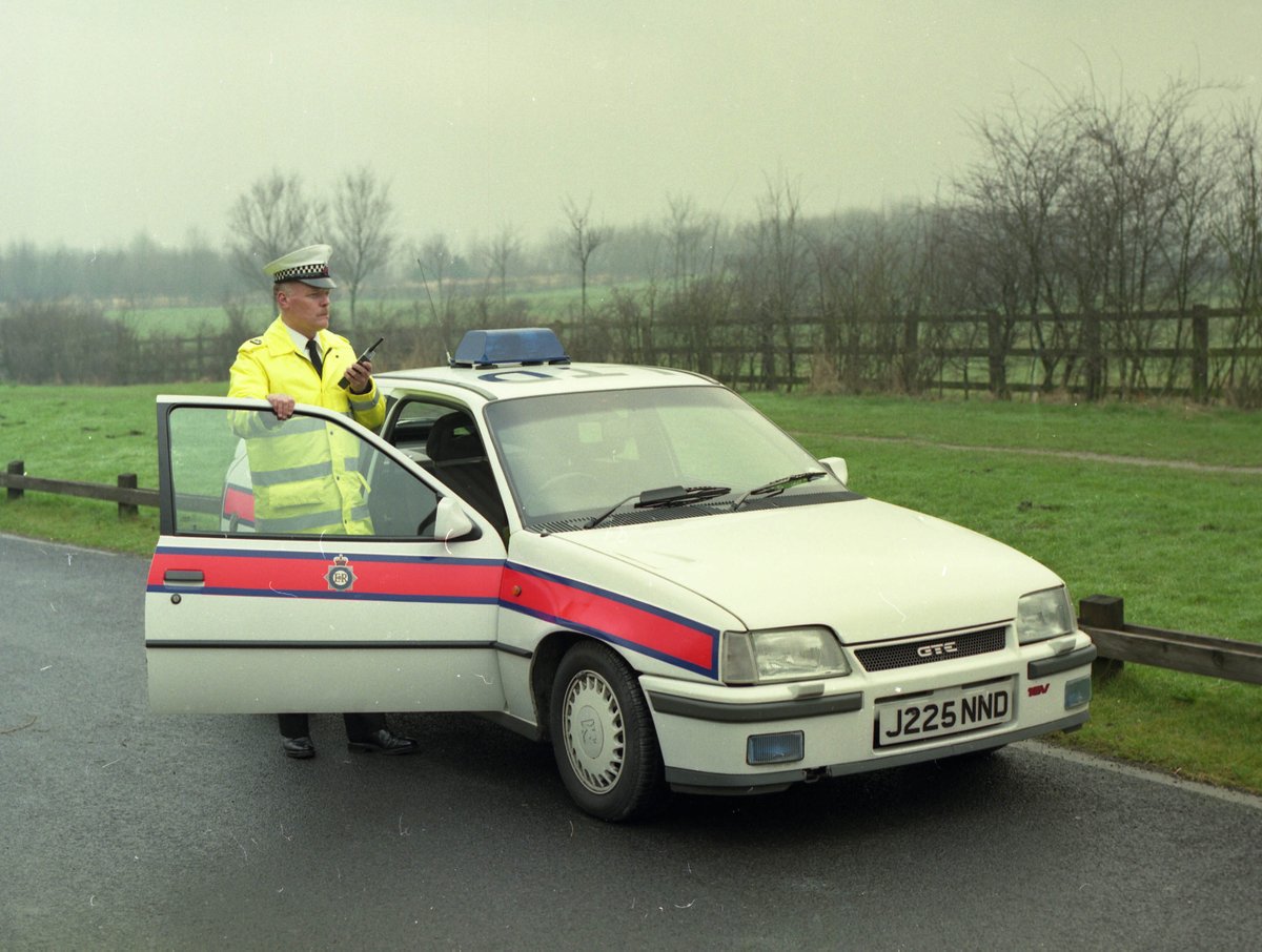 #GMP50 | A Greater Manchester Police officer poses with his Vauxhall Astra vehicle back in 1993. The cars may have changed, but the distinctive white hat that traffic officers wear remains. #TBT #ThrowbackThursday