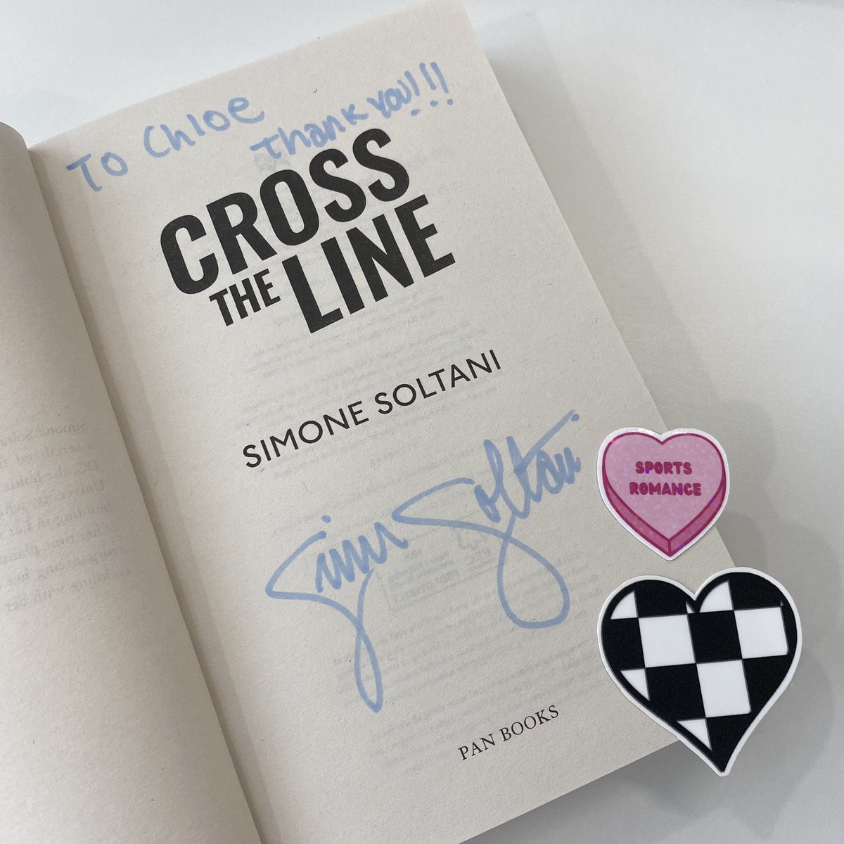 A macaron-sweet celebration at the office today to mark publication of #CrossTheLine by @simonesoltani - complete with toy cars, obligatory macarons, F1 stickers and @lenikauffman’s beautiful illustration of Willow and Dev on cupcakes 🏎️