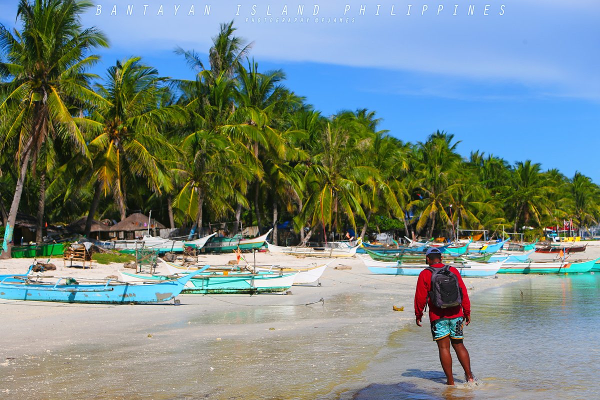 Island Life Therapy: The colors of rural Beach Life, with beautiful green Palm Trees, under a Blue Sky: Bantayan Island Cebu, The Philippines. Canon 1Dx. #ThePhotoHour #travelphotography #IslandLife #bantayanisland #bantayan #photography #StormHour #ShotOnCanon #weather