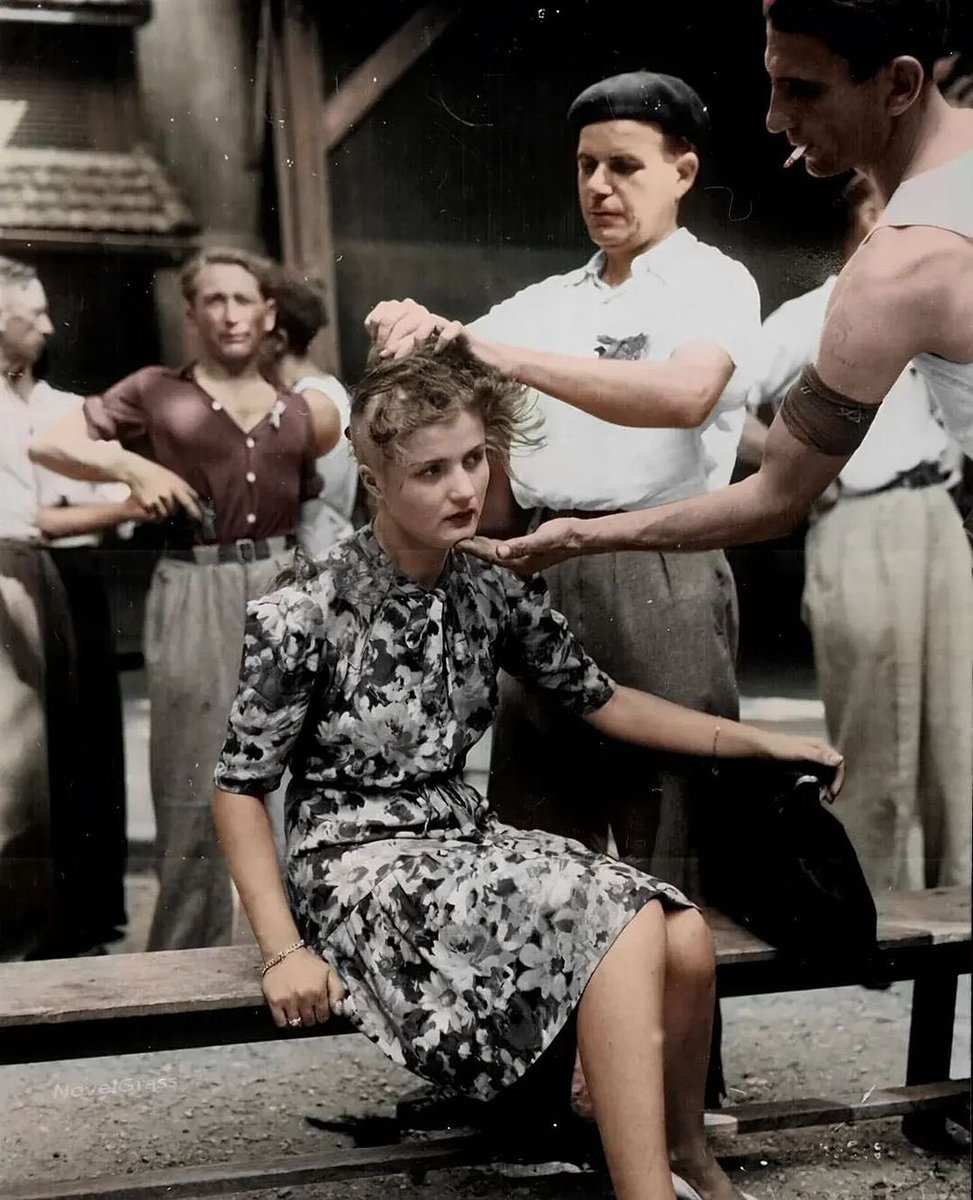 A French woman has her head shaved as a public punishment for collaborating with German soldiers, 1944.