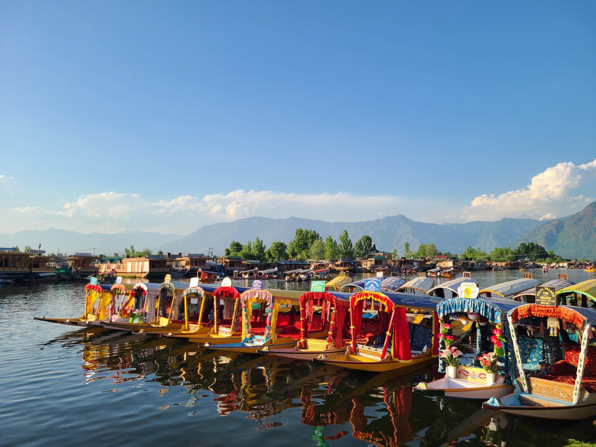 Golden hour at Dal Lake #Srinagar: where shikaras rest and mountains stand tall.