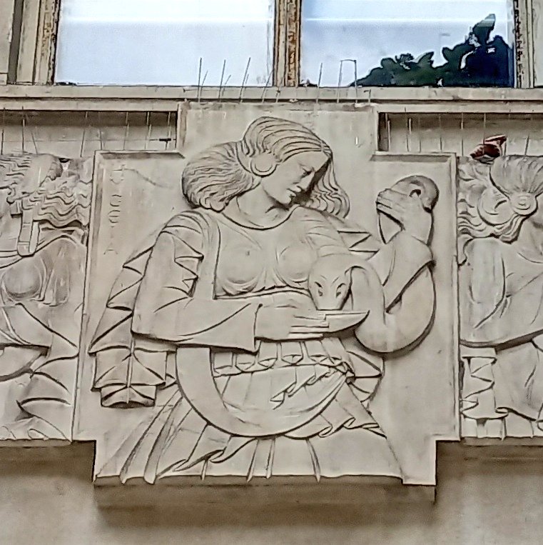 passienus's tweet photo. Art Deco Hygeia, goddess of health above the entrance to the Princess Royal Nurses Home building at Gt Ormond St Hospital. Some Disneyish looking Muses at Victoria Theatre. And a Roman procession on the Shaftesbury Ave Odeon. #LondonClassical https://t.co/1KOiewjE8m