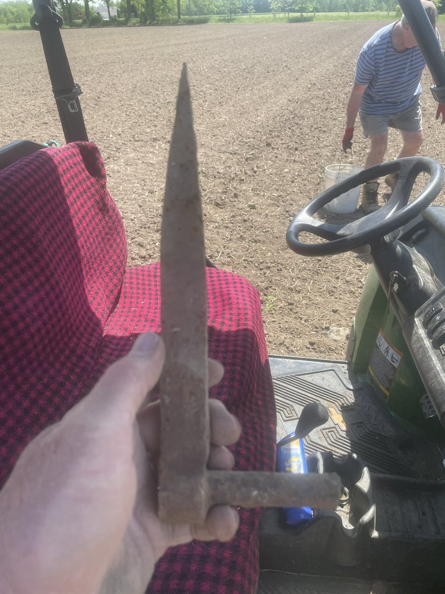 There is likely more than one of these hinge bolts buried here where the old barn was