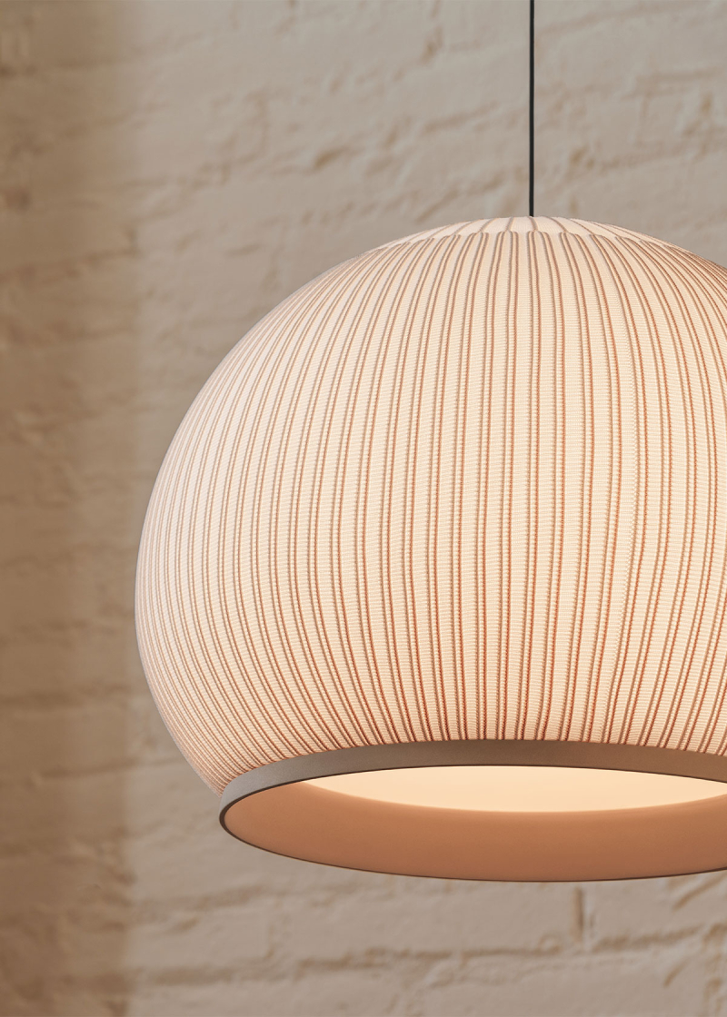 Vibia - Knit
The Knit collection reimagines the traditional lampshade, transforming it into a contemporary look. Light seeps through the fabric outwards and downwards through a translucent diffuser, bathing the surrounding space in an intimate glow.