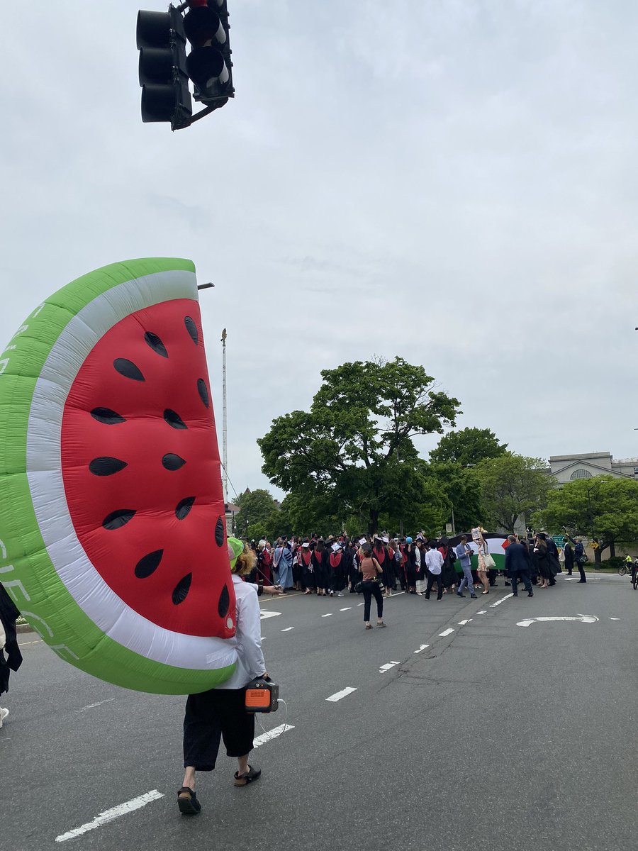 MaxKrupnick's tweet photo. Hundreds of #Harvard graduates walked out of this morning’s commencement to protest Israel’s war in Gaza and the university’s decision to bar 13 seniors from graduating due to the encampment. I spoke with student protesters at “The People’s Commencement.” https://t.co/rbS0IcI08V https://t.co/ChLUPK2KgZ