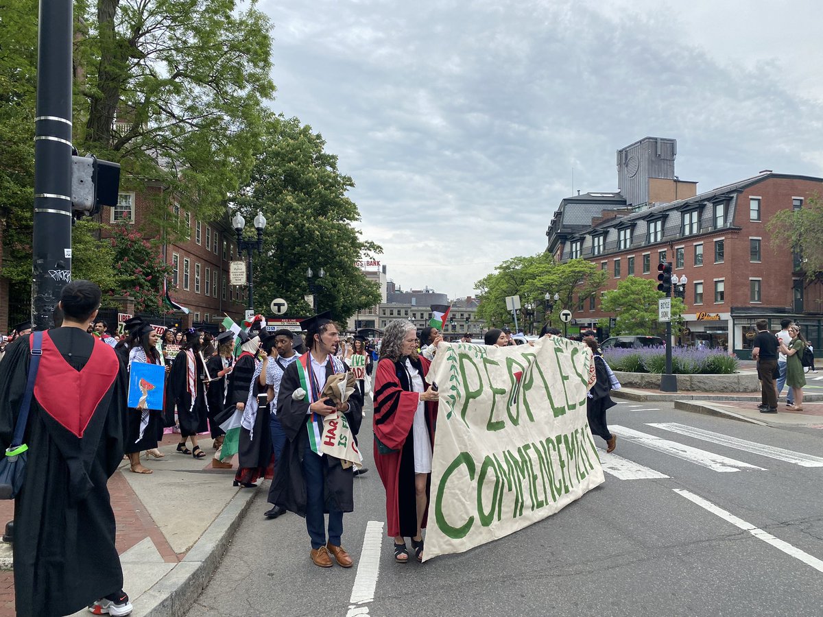 MaxKrupnick's tweet photo. Hundreds of #Harvard graduates walked out of this morning’s commencement to protest Israel’s war in Gaza and the university’s decision to bar 13 seniors from graduating due to the encampment. I spoke with student protesters at “The People’s Commencement.” https://t.co/rbS0IcI08V https://t.co/ChLUPK2KgZ
