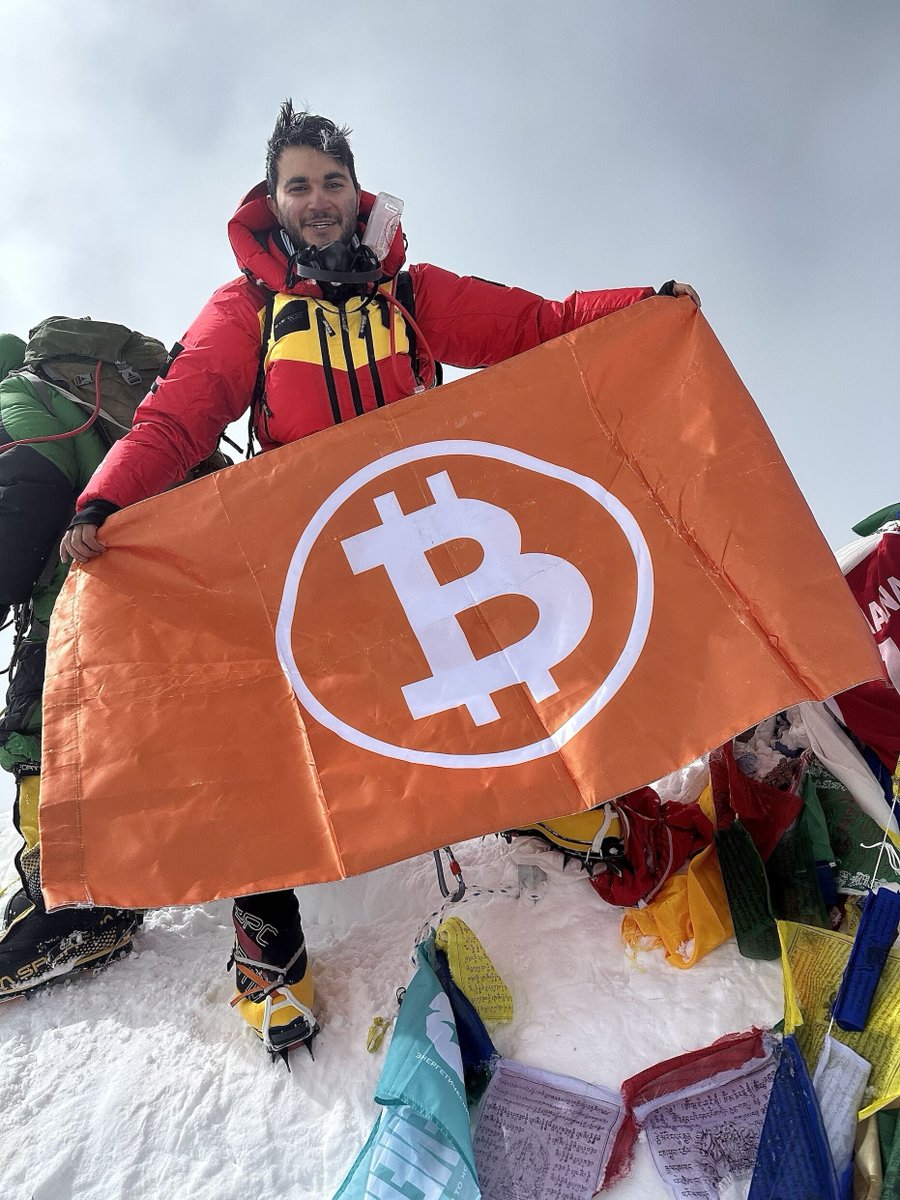 Cointelegraph's tweet photo. After summiting Mount Everest, 23-year-old Bitcoiner @Cryptonnis raised the #Bitcoin flag after a 50-day journey to the top. https://t.co/dcXZ1dYViA