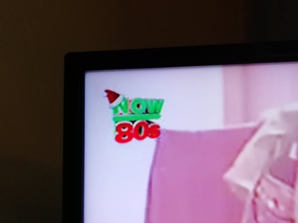 MikeGne's tweet photo. I know some start in September but Now80s having their Christmas logo on tonight... A mistake surely... 😶 https://t.co/MfXNFzH8xI