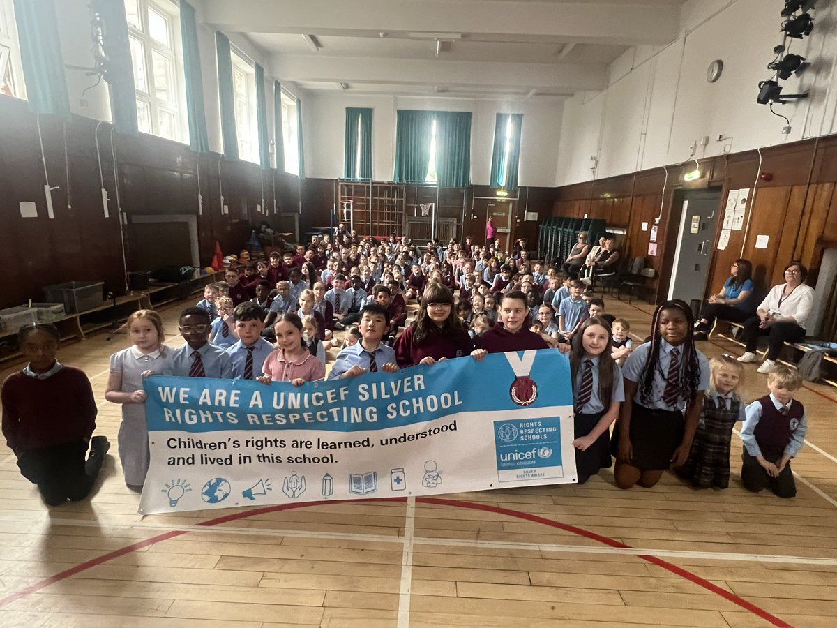 StCharlesGla's tweet photo. Our #RightsRespectingCommittee unfurled our new #Silver banner to show everyone at assembly on Monday. This afternoon at our #LeadershipAfternoon they shared our #RightsRespecting journey with our visitors, telling them all about #Gloria our mascot and how #ChildrensRights are #Learned, #Understood and #Lived in our school. #UNCRC #PupilVoice @UNICEF @UNICEF_uk @garycondie67 @TheLeaderinMe