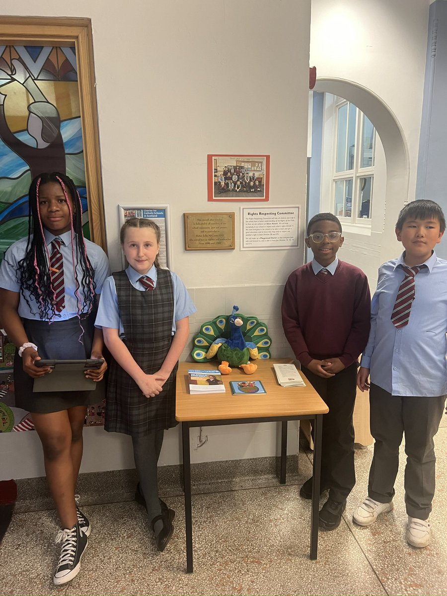 StCharlesGla's tweet photo. Our #RightsRespectingCommittee unfurled our new #Silver banner to show everyone at assembly on Monday. This afternoon at our #LeadershipAfternoon they shared our #RightsRespecting journey with our visitors, telling them all about #Gloria our mascot and how #ChildrensRights are #Learned, #Understood and #Lived in our school. #UNCRC #PupilVoice @UNICEF @UNICEF_uk @garycondie67 @TheLeaderinMe