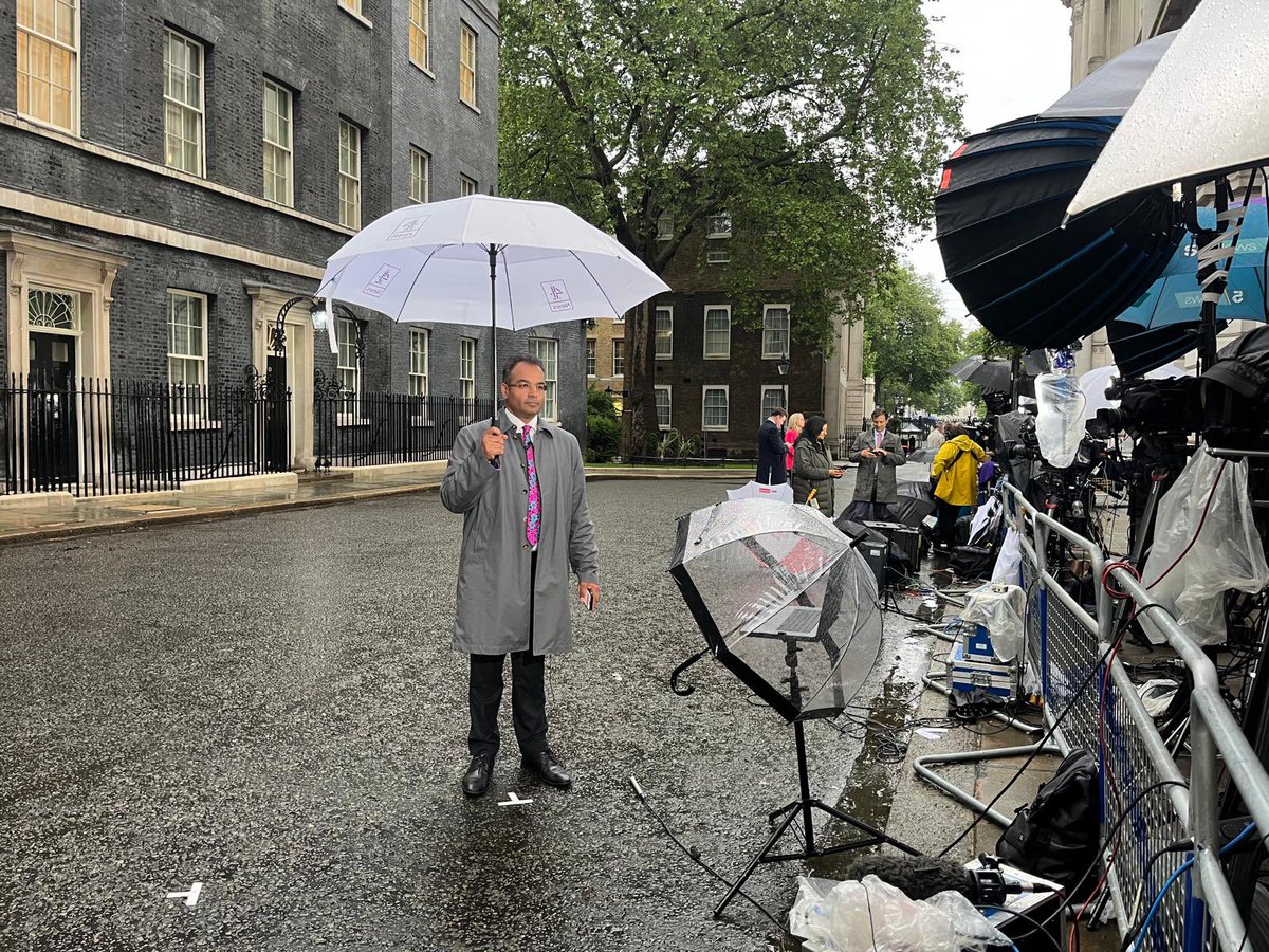 Just making memories. I was doing #c4news in Downing Street while @Geetagurumurthy was doing #bbcnews while Rishi Sunak called the election and got drenched in the rain to the sound of Things Can Only Get Better courtesy of anti-Brexit protesters at the gates. Another bizarre day