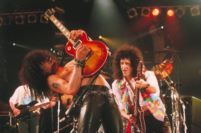 Brian May performs with Slash at the Freddie Mercury Tribute Concert, 1992.