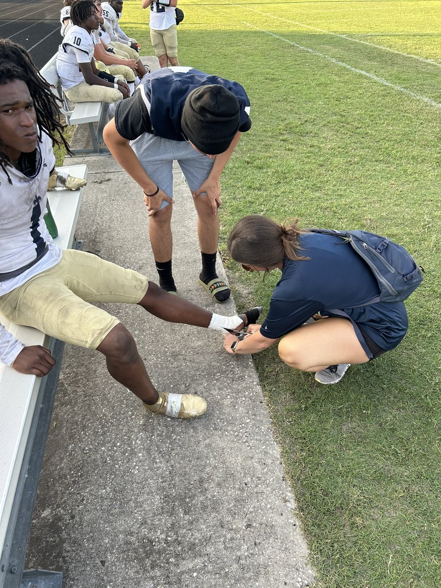 Anna, Athletic Trainer from @sandalwoodathl1 takes care of an injured ankle tonight during their spring football 🏈 game @DuvalSchools