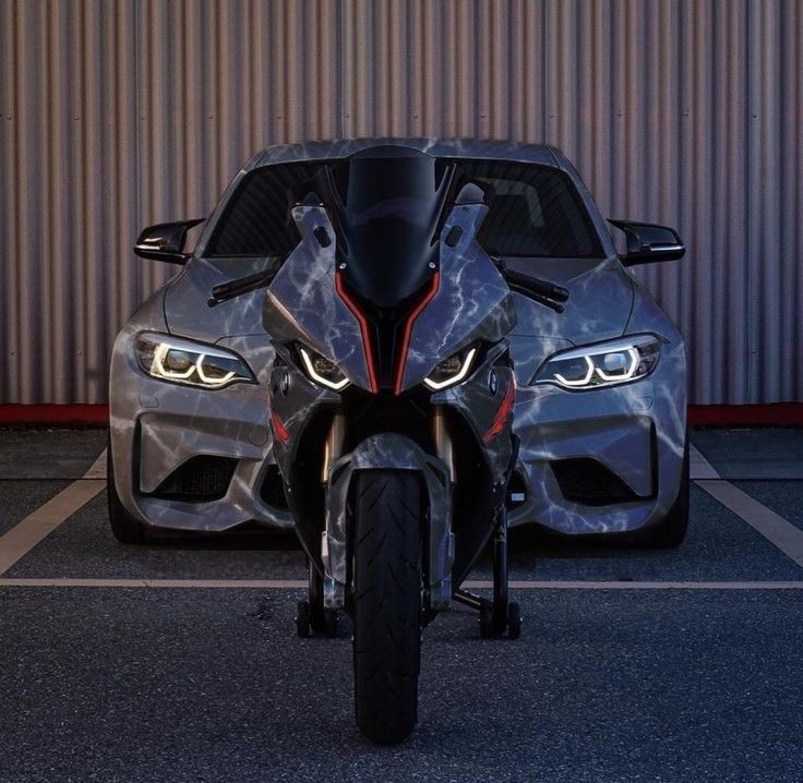 The story of a BMW bike standing proudly in front of a sleek car, showcasing a perfect harmony of speed and style on the open road. One can almost feel the thrill of the ride and the admiration of onlookers as this dynamic . #BMW #bikelife #carsofinstagram #speedandstyle