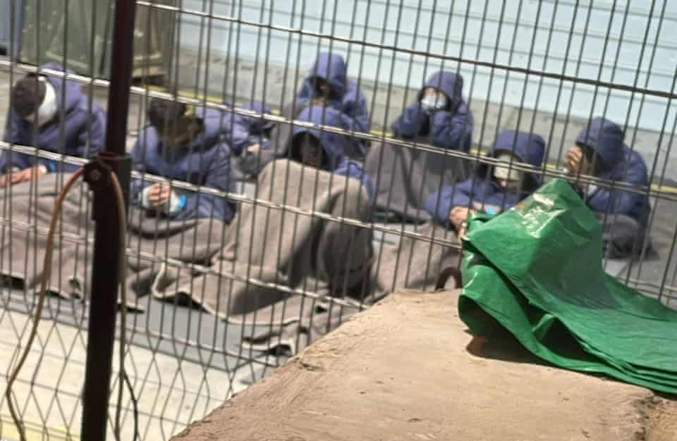 “The prisoners are detained in a sort of cages, all blindfolded and handcuffed,” the source said. “If someone speaks or moves, they are immediately silenced or they are forced to stand with their hands raised above their head and handcuffed for up to one hour. If they are unable