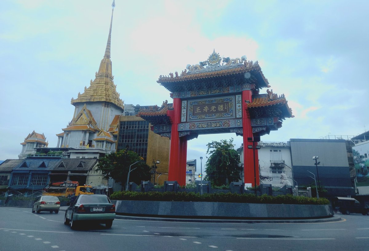 Odeon Circle is a roundabout in Bangkok. It was built by Thai Chinese descents as part of the celebrations of King Bhumibol’s 72nd anniversary in 1999. It is known as a gateway of Bangkok's Chinatown. You can see Wat Trimit is on the left Bangkok, Thailand