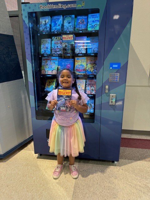 My baby girl won a book vending machine token this quarter for completing the April @zoobeanreads challenge! She loves nonfiction books! #readersareleaders #OCPSreads