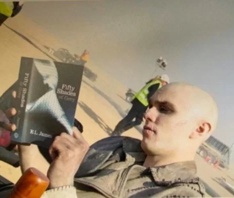nicholas hoult knitting and reading fifty shades of grey in between takes of mad max: fury road