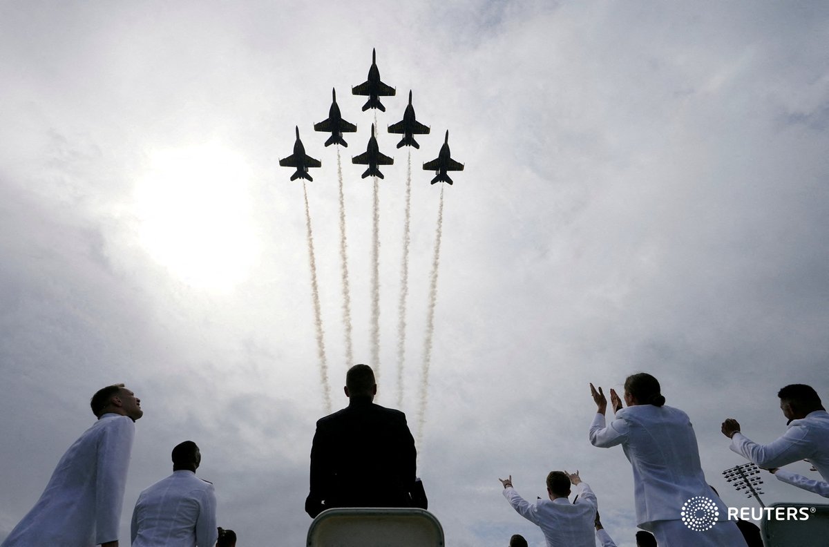 The U.S. Navy Blue Angels perform a fly-over during the commissioning and graduation ceremony at the U.S. Naval Academy in Annapolis, Maryland. Photo by Kevin Lamarque