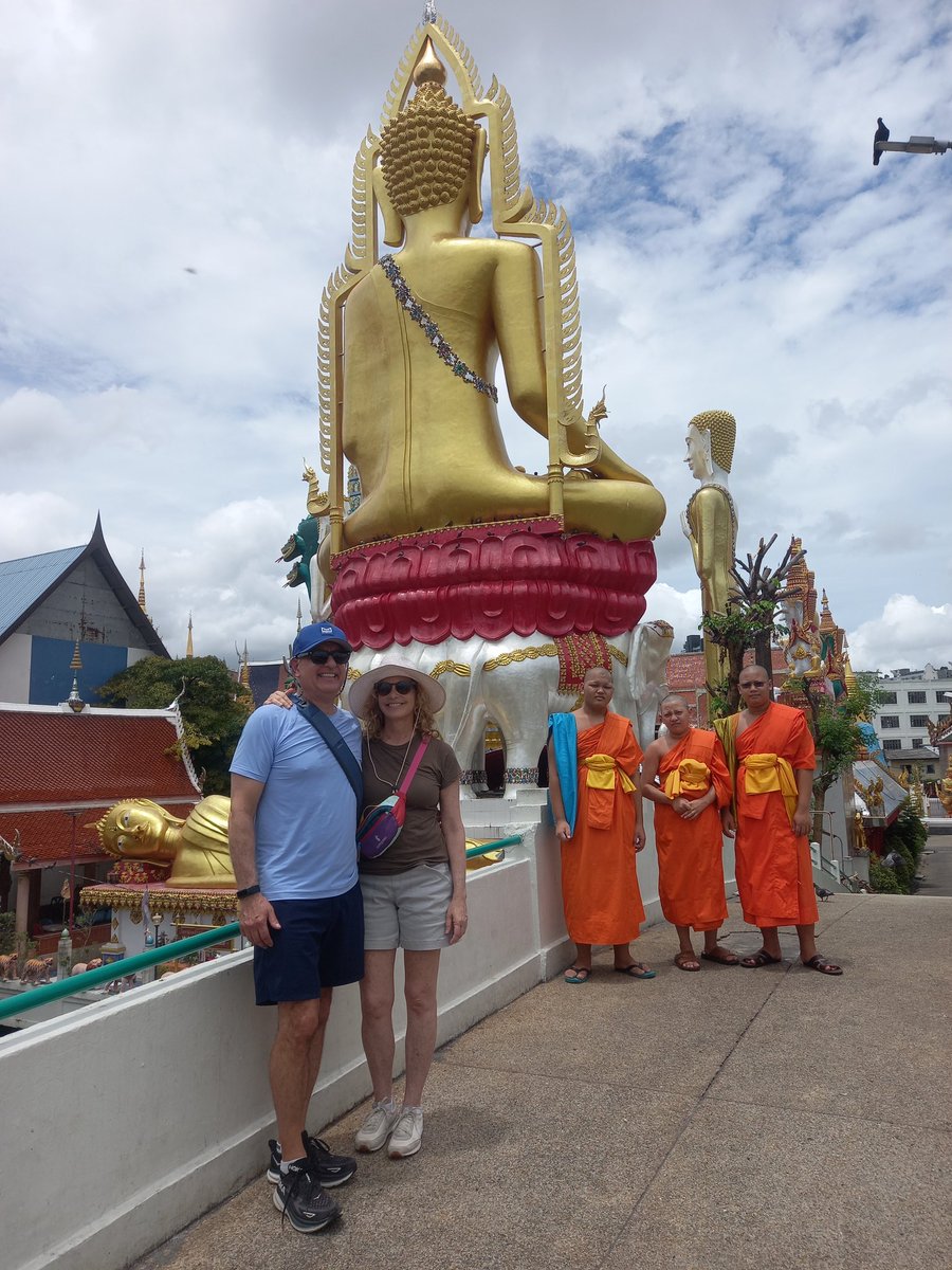 This American couple would like to have a photo taken with Thai Buddhist novices. I told them not to stand closely to the novices. Wat Khun Chan (opposite Wat Paknam Phasi Charoen) Bangkok, Thailand